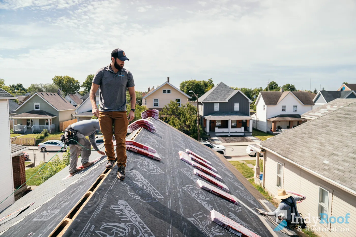 Tarping and dry-in on a Holliday Farms commercial roof